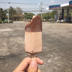 Hand holding ice cream cone