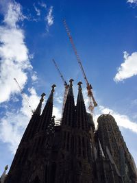 Low angle view of temple against cloudy sky