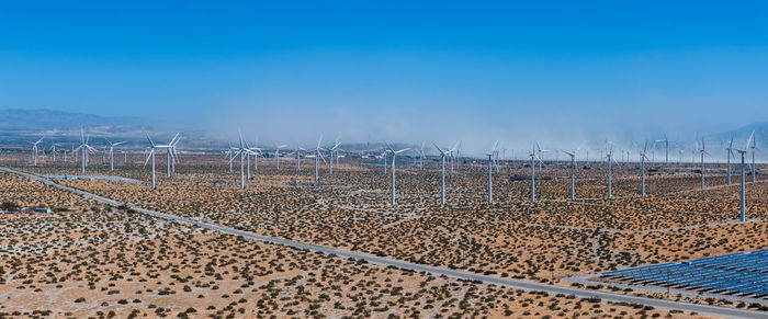 Scenic view of landscape against clear blue sky