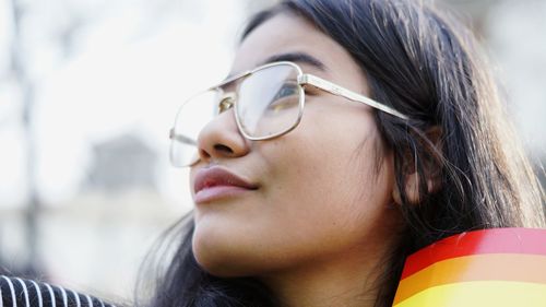 Close-up of young woman wearing eyeglasses