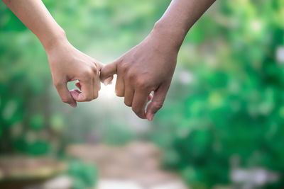 Cropped hand of man holding hands