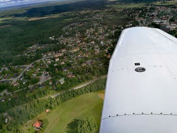 Aerial view of airplane wing over landscape