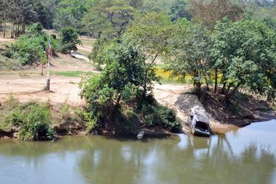 Scenic view of lake along trees