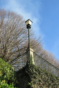 Low angle view of street light against sky