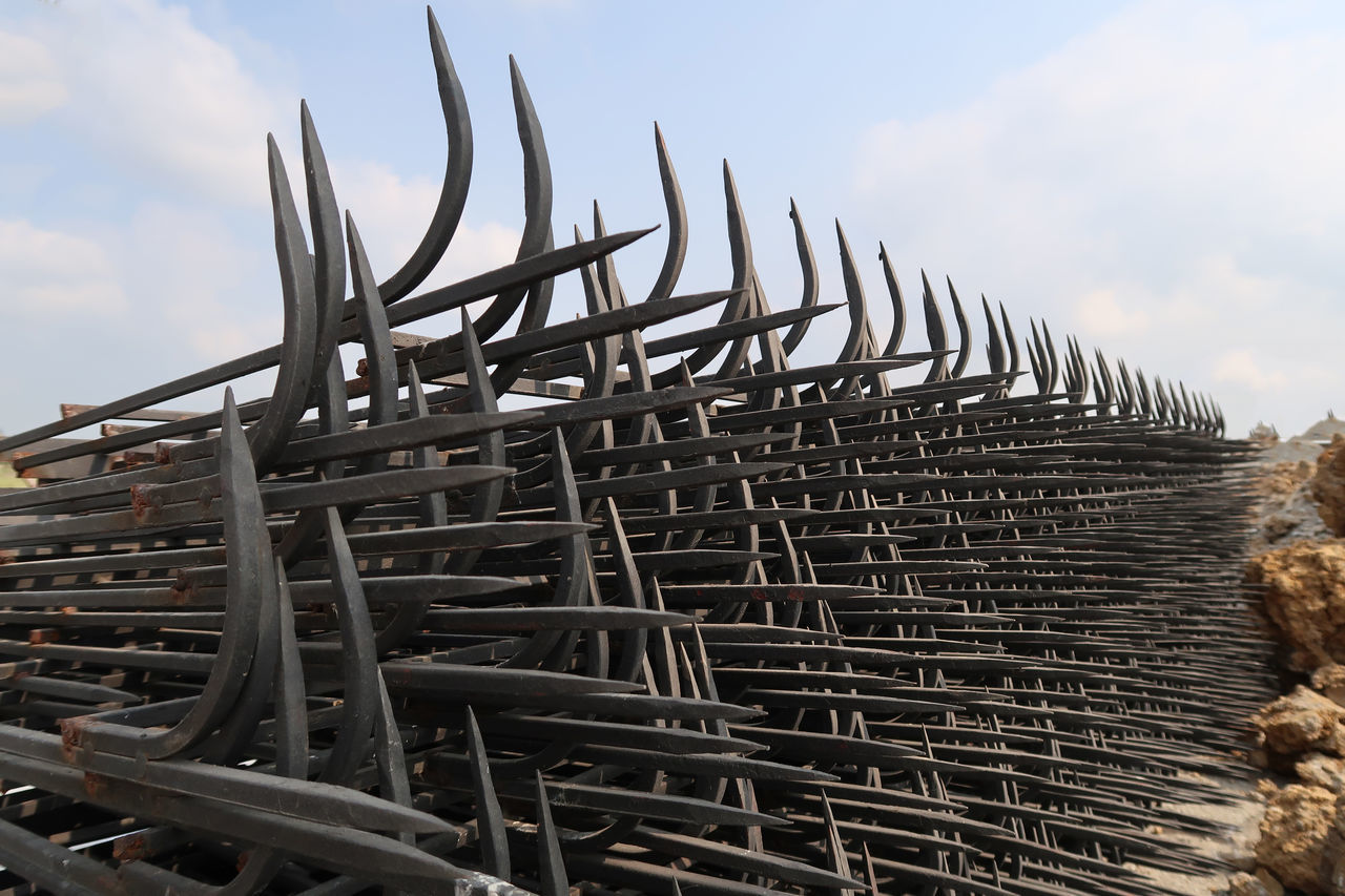 LOW ANGLE VIEW OF METALLIC STRUCTURE ON FIELD