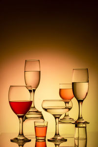 Glassware of different sizes against colorful background