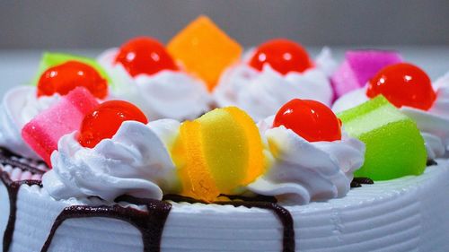 Close-up of multi colored cake on table