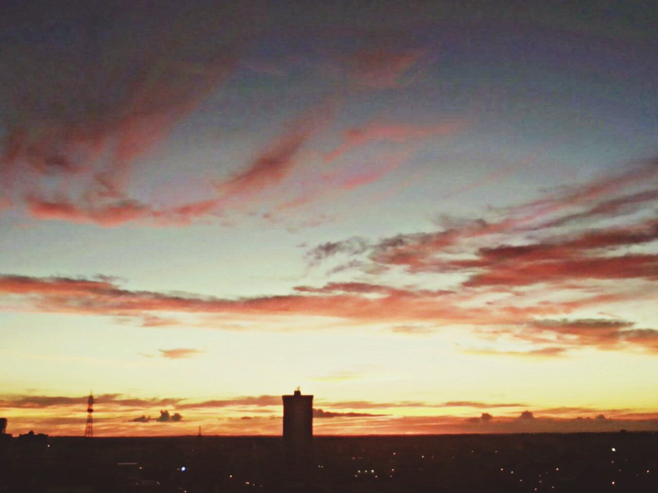 sunset, silhouette, sky, orange color, cloud - sky, scenics, beauty in nature, built structure, dramatic sky, architecture, building exterior, tranquility, tranquil scene, nature, cloud, idyllic, cloudy, low angle view, moody sky, dusk