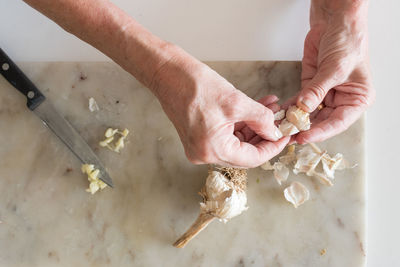 High angle view of man preparing food on table