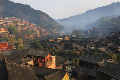 High angle view of townscape and mountains