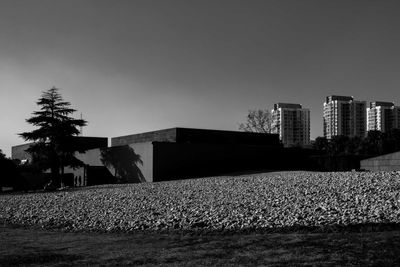 Modern buildings in city against clear sky