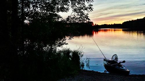 Scenic view of calm lake at sunset