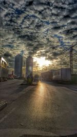 Empty road against cloudy sky