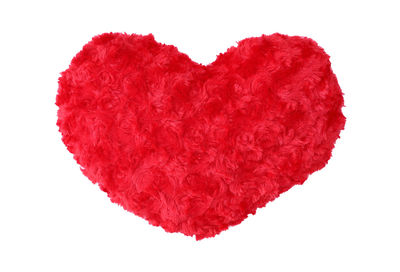 Close-up of red heart shape against white background