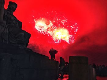 Low angle view of silhouette statue against sky at night