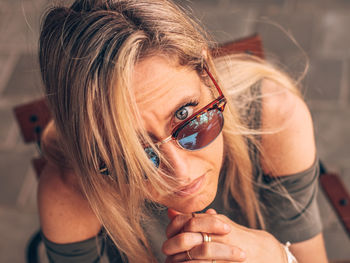 Close-up portrait of mature woman wearing sunglasses 