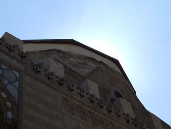 Low angle view of historical building against clear blue sky