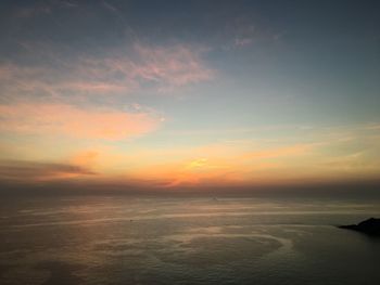 Scenic view of sea at sunset