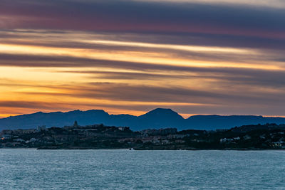 Scenic view of sea against orange sky