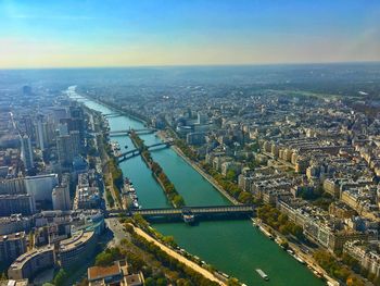 High angle view of bridge over river by buildings in city