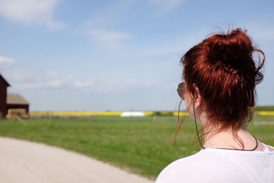 Rear view of a woman in field