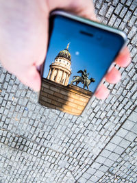 Reflection of berlin cathedral in smartphone