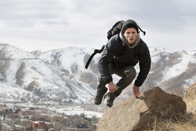 Full length of man standing on snow