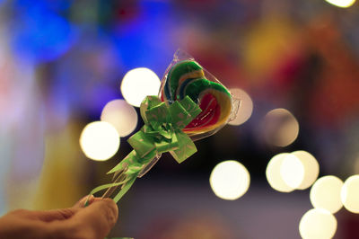 Close-up of hand holding illuminated lights