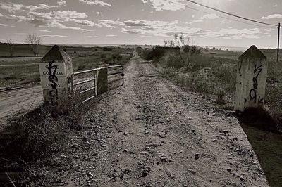 View of road against cloudy sky