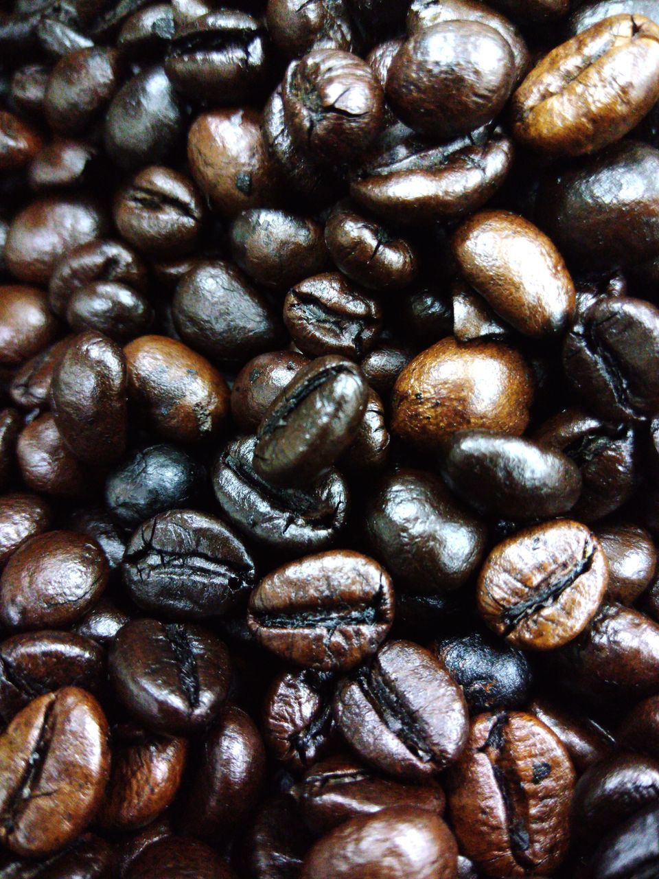 FULL FRAME SHOT OF COFFEE BEANS IN BACKGROUND