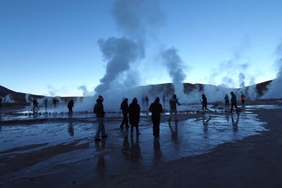 Panoramic view of people on beach