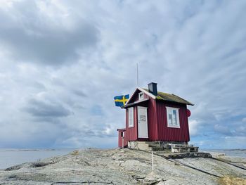 Built structure on beach against sky