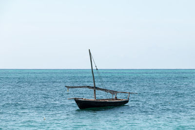 Boat in sea against clear sky