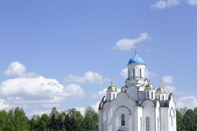 Low angle view of church and building against sky