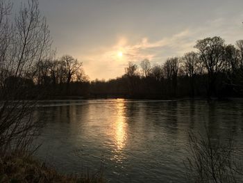Scenic view of lake against sky during sunset
