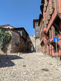 Low angle view of buildings against blue sky