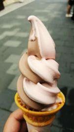 Close-up of hand holding ice cream