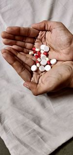 Close-up of person holding pills