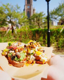 Cropped image of hand holding coffee
