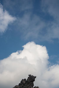 Low angle view of rock against sky