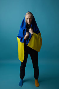 Young woman with ukrainian flag