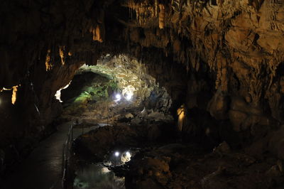 Illuminated tunnel in cave