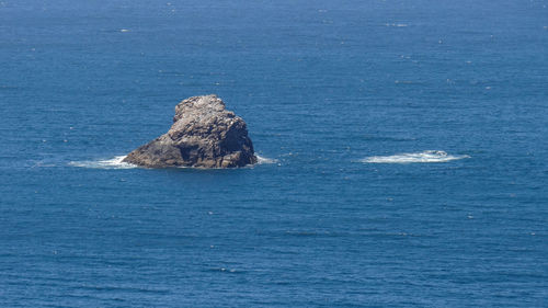 High angle view of rock in sea