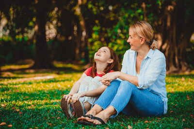 Young women sitting on grass