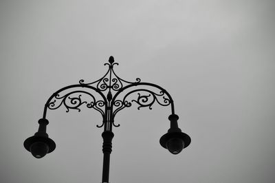 Low angle view of street light against sky