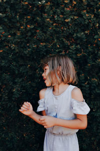 Full length of girl standing on field