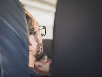 Close-up of man holding eyeglasses