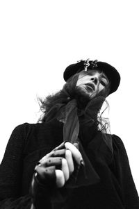 Low angle portrait of woman against white background