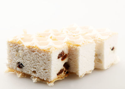 Close-up of cake against white background