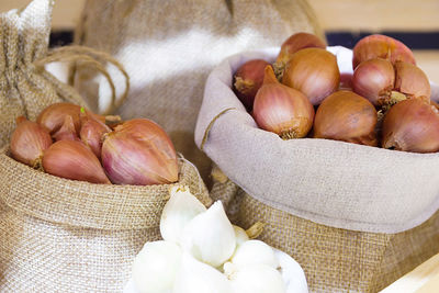 Close-up of onions in sack